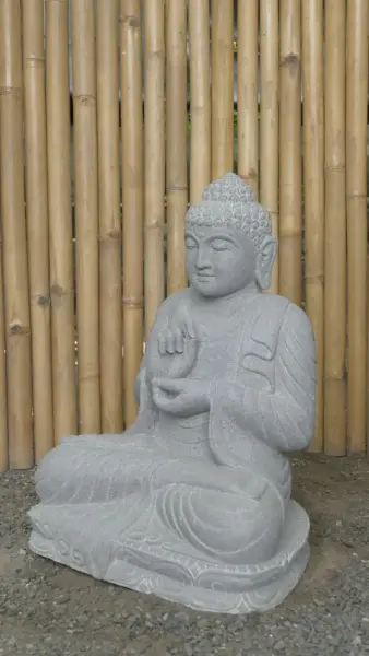 Product image of the product “Seated Buddha made of Riverstone in Dharmachakra position - gesture of wheel of the teaching of Dharma. About 61cm height. ”